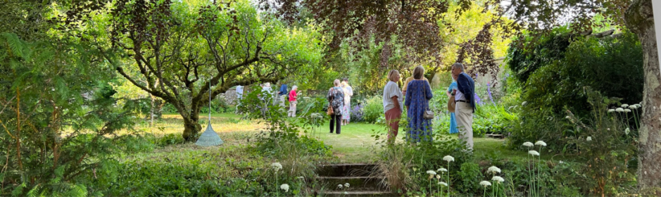 Beautiful garden with people standing and chatting
